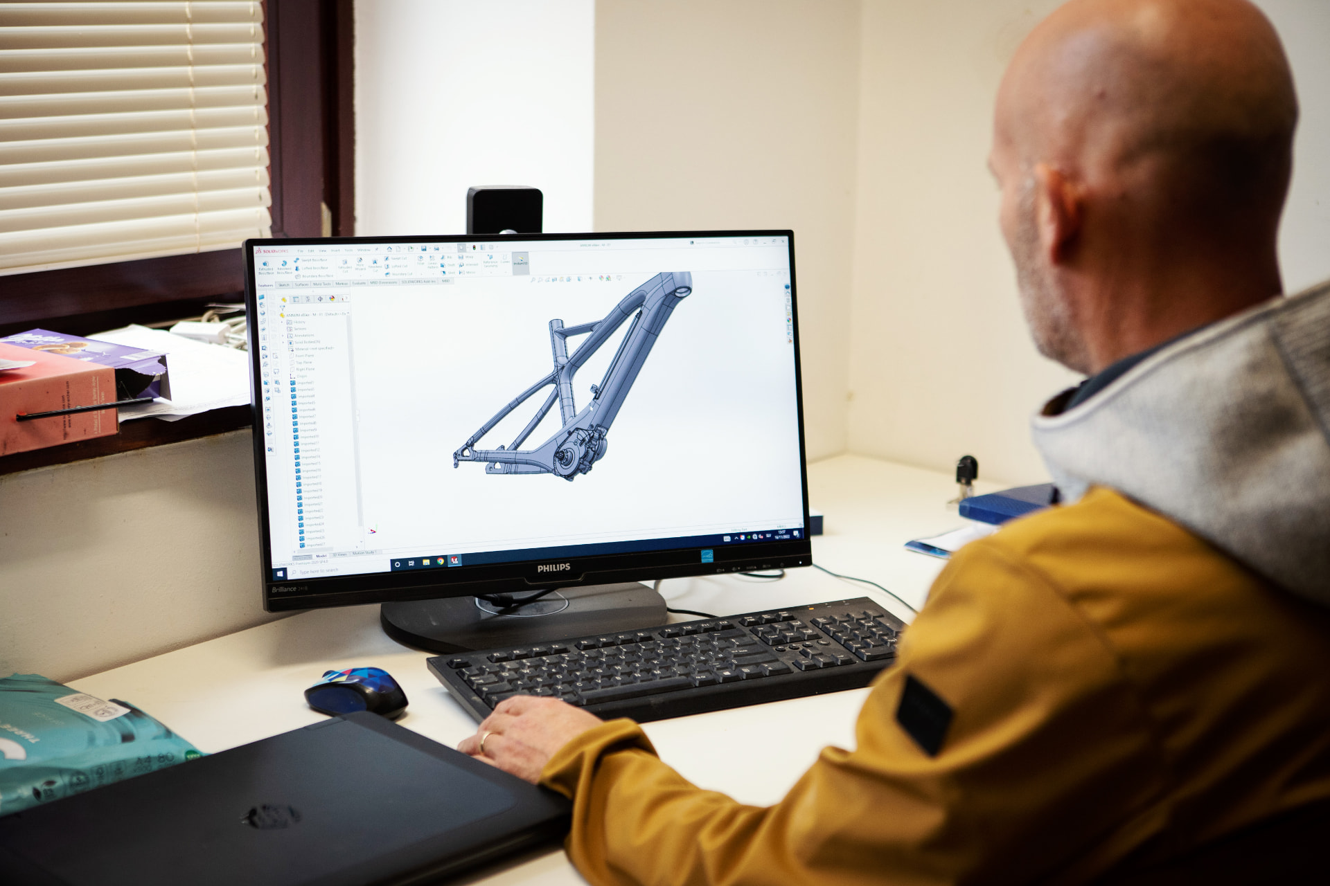 Annum designer developing a wooden indoor bike frame in CAD at the Slovenian atelier