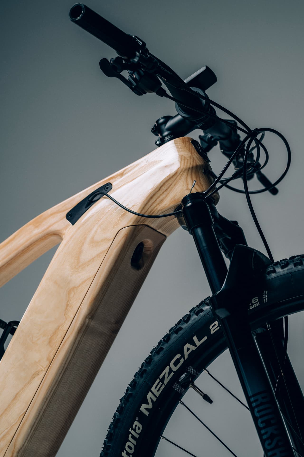 Head tube and fork detail of an Annum wooden bicycle